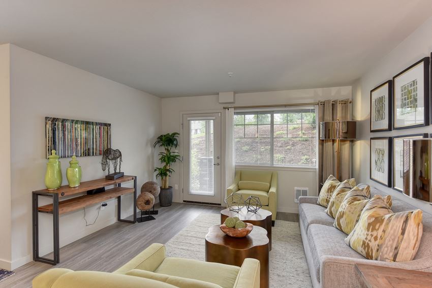 Dining Area with Wood Inspired Floor, Lime Green Chairs, Grey Sofas/ Chairs, Open View Windows, Brown Decorative Tables with Fruitbowl - Photo Gallery