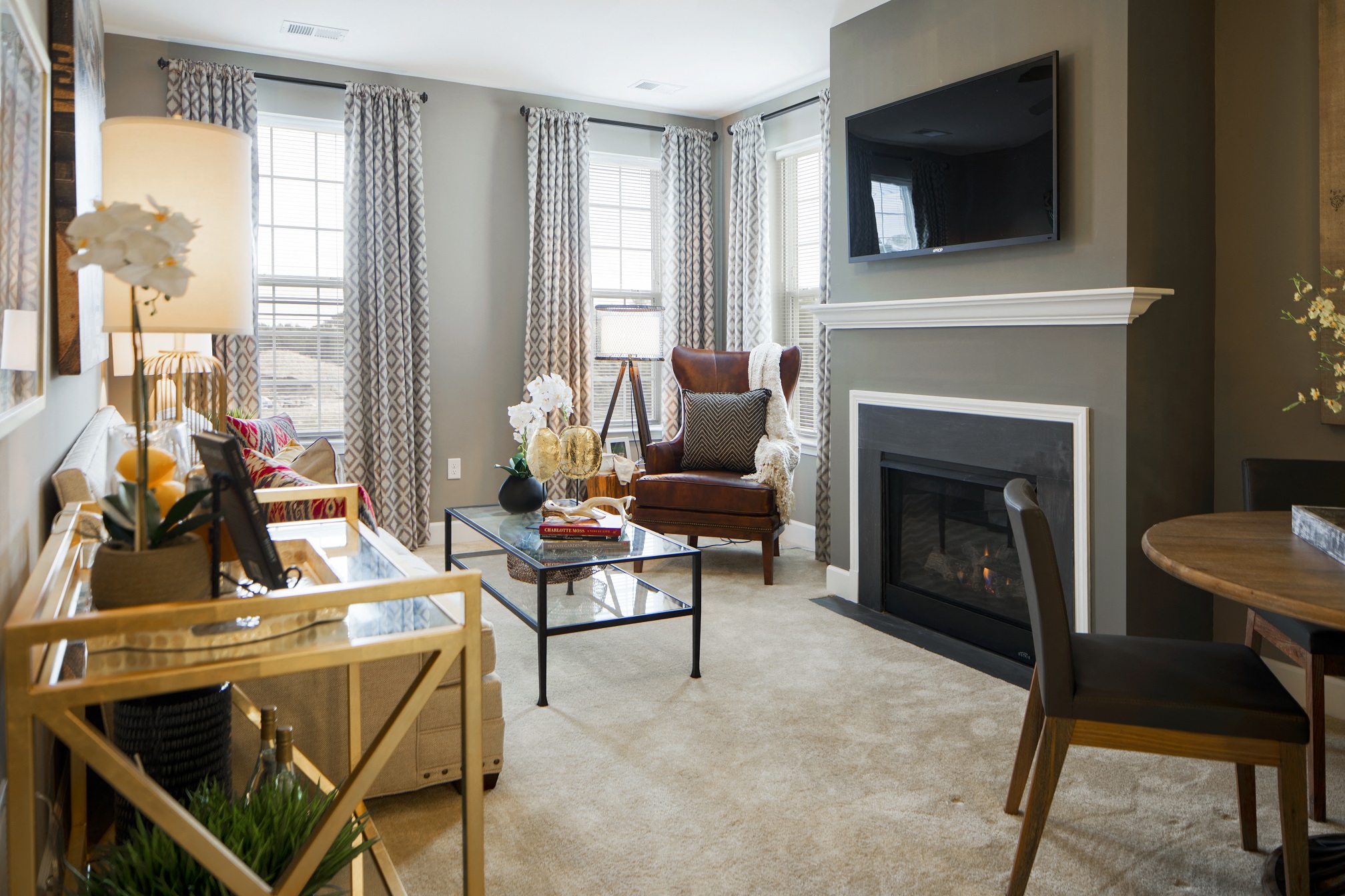 a living room filled with furniture and a fireplace