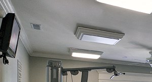 a gym with various cardio machines and weights