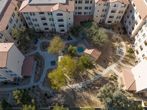 an aerial view of the courtyard of an apartment building