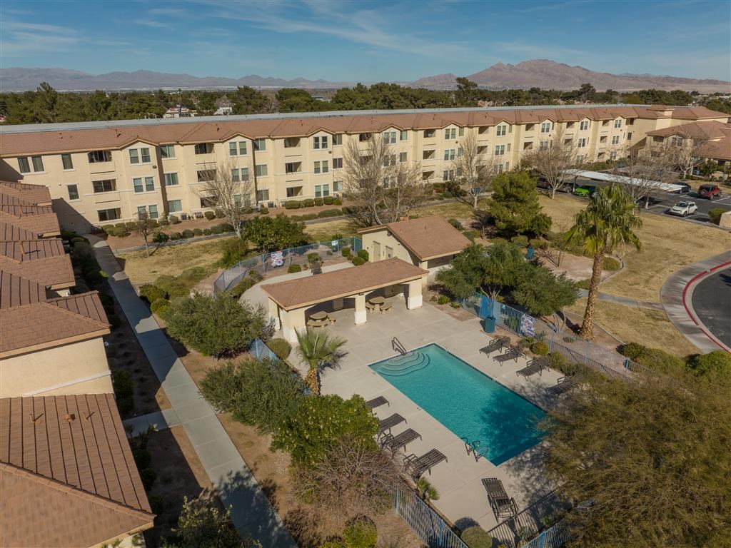 an aerial view of the resort with a swimming pool