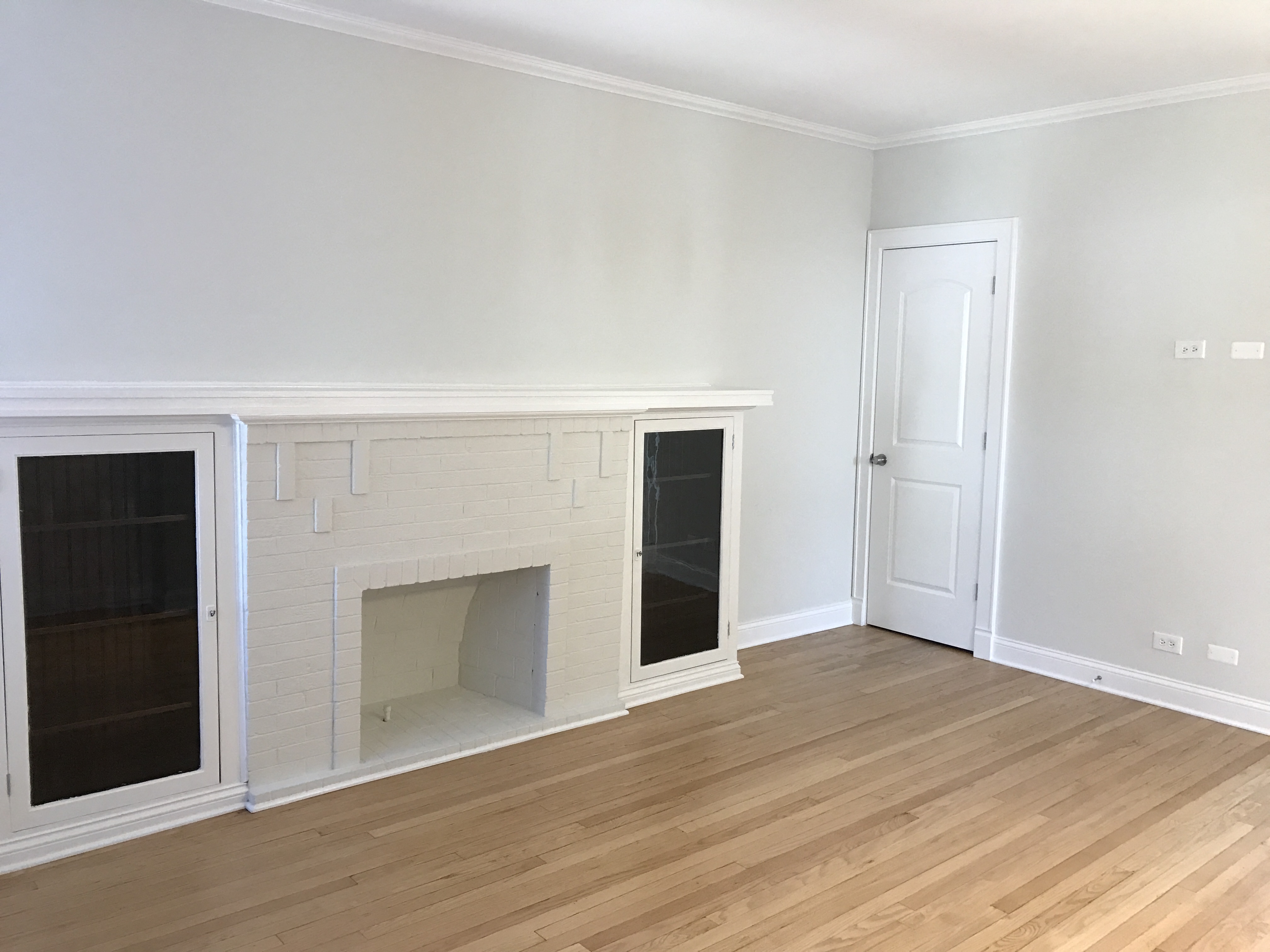 the living room with the fireplace and the door to the office