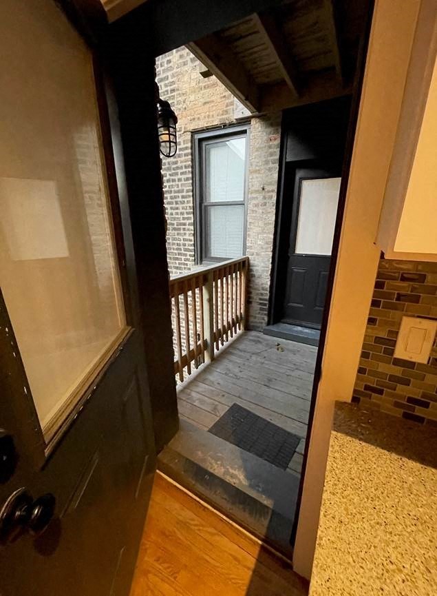 the front door of a house with a porch
