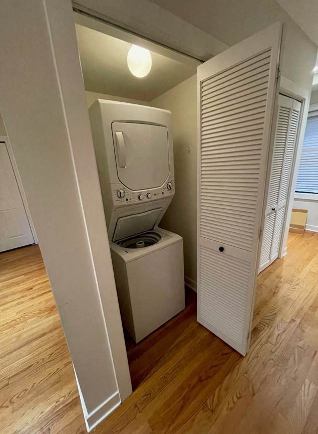 a room with a television and a washing machine in it