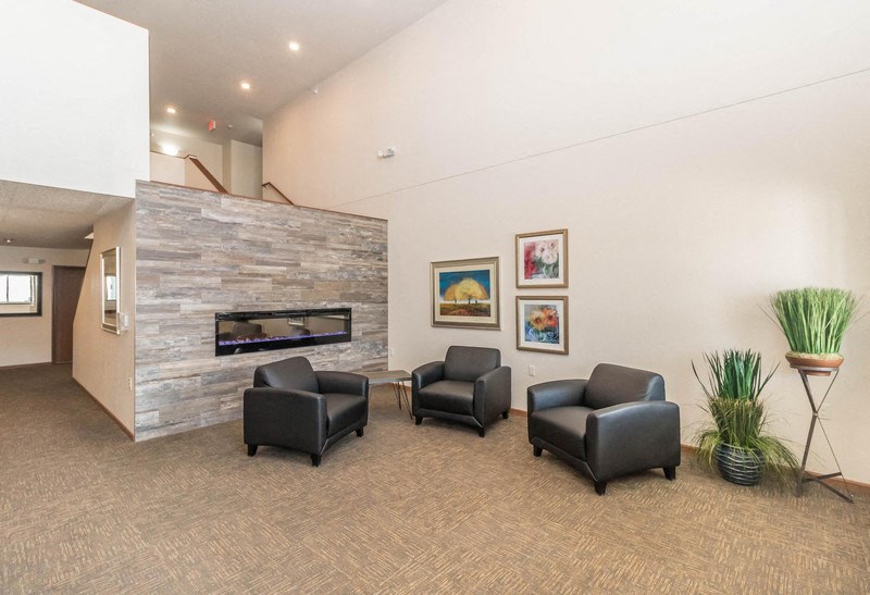the preserve at ballantyne commons living room with chairs and a fireplace