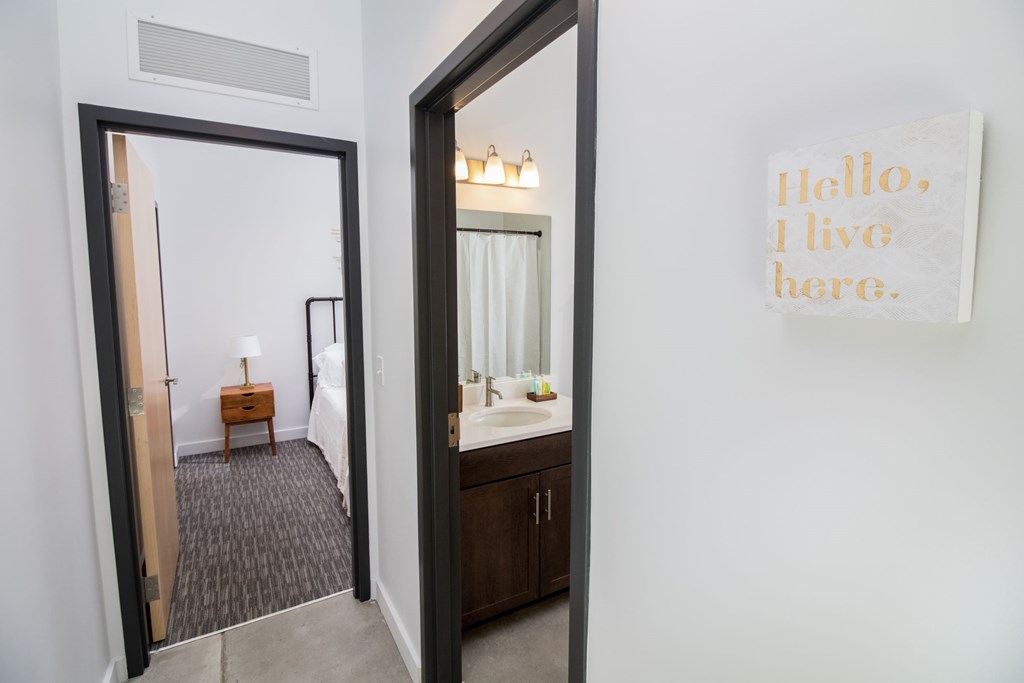 the view of a bathroom from a mirror in a hotel room