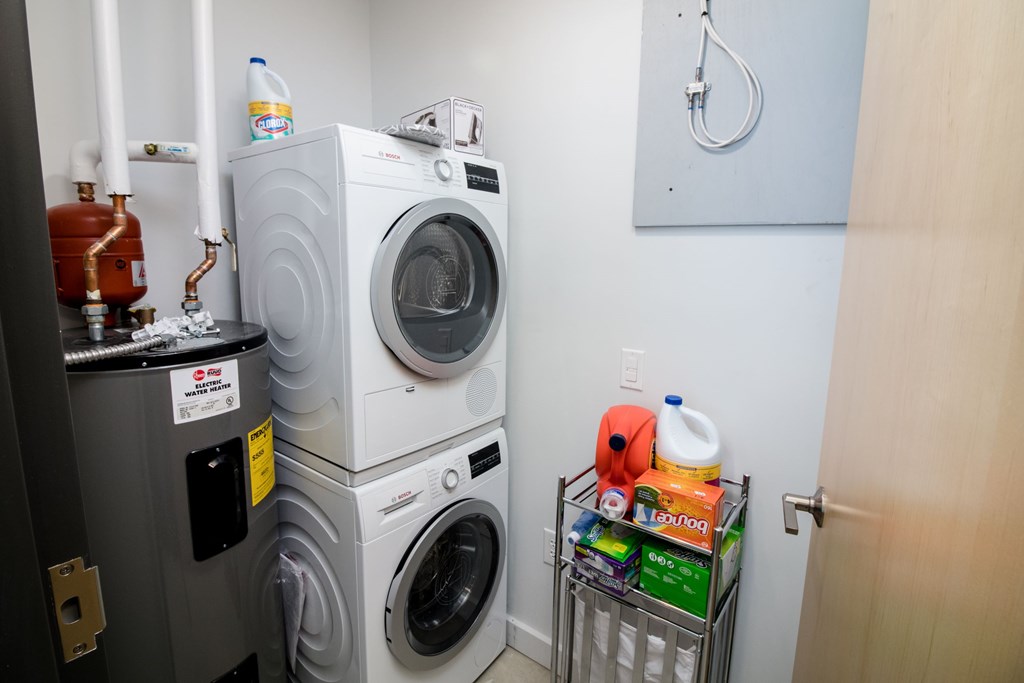 a small laundry room with a washing machine and a dryer