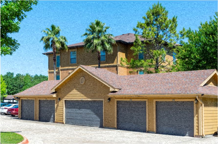 a house with a garage with three garage doors
