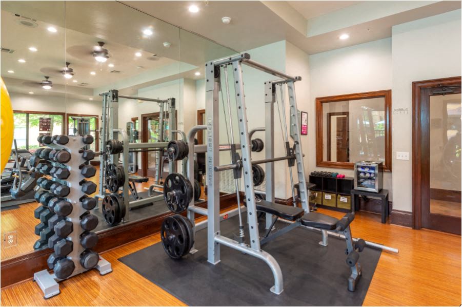 the home has a gym with weights and other equipment