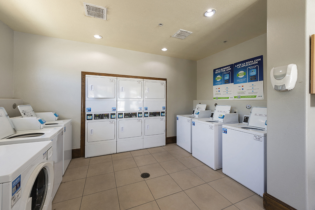 the laundry room is equipped with washers and dryers