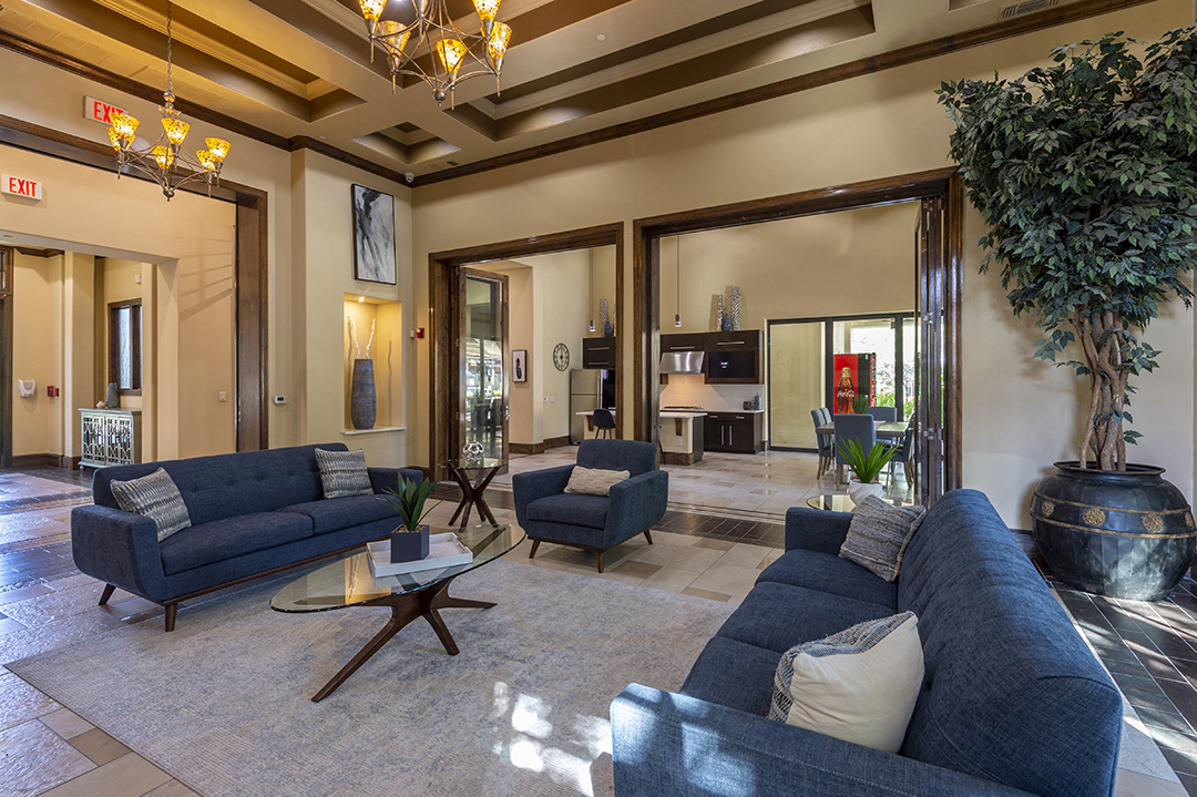 a living room with couches and chairs and a table