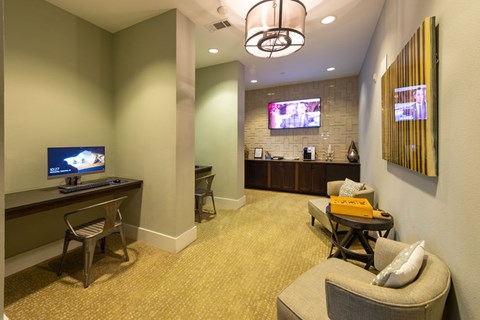 A living room with a television and a chair.
