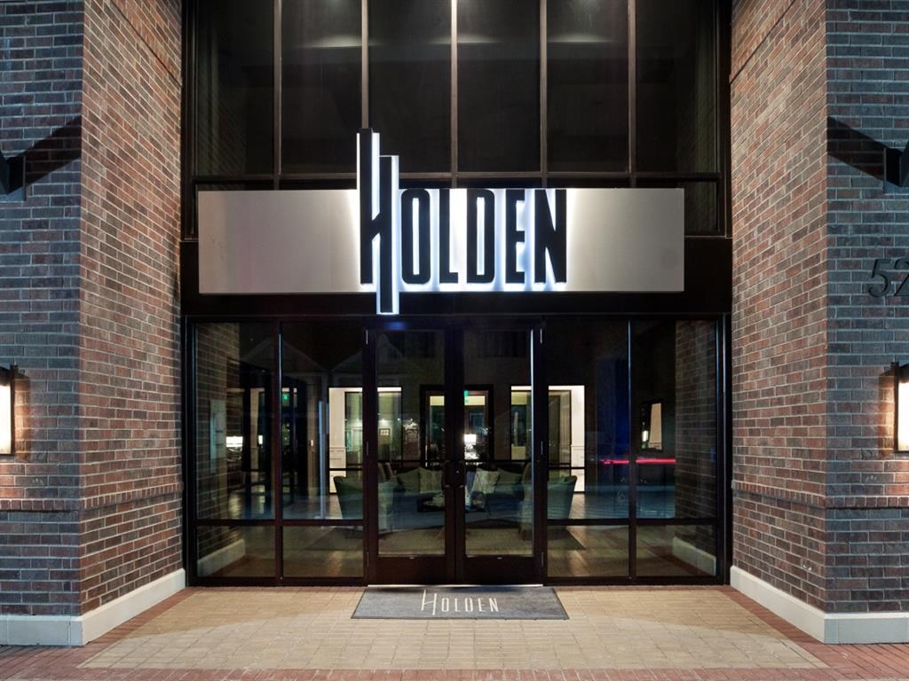 the entrance to a building with a sign on the door