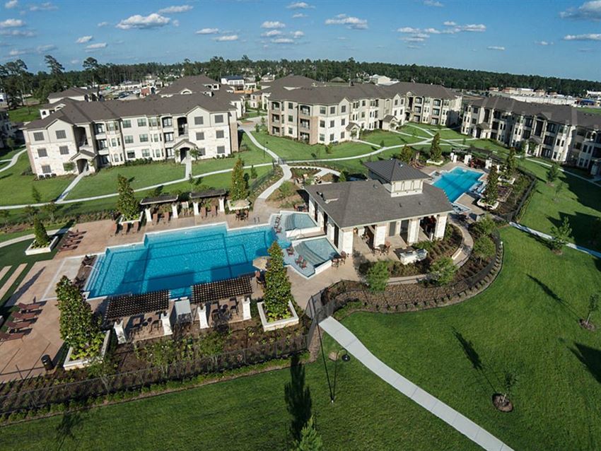 an aerial view of the resort with a large pool