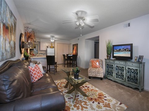 a living room with a couch and a tv