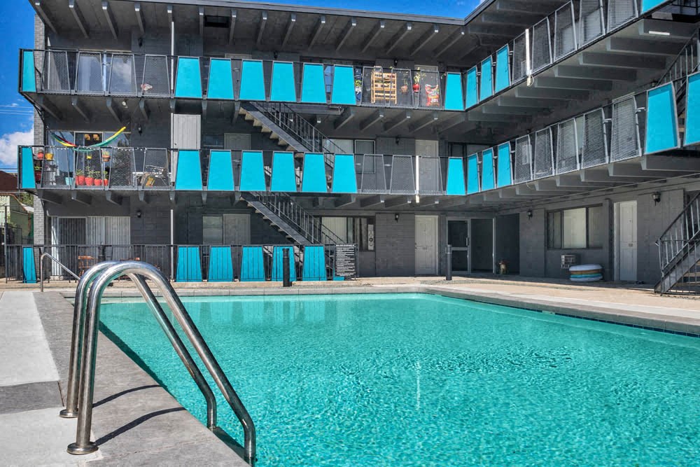 a swimming pool at a hotel with a ladder next to it