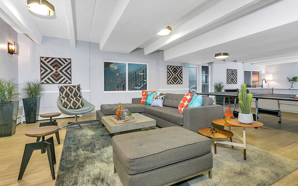 a living room with a couch and a table