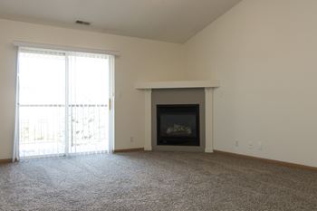 Corner gas fireplace for coziness in the living room at The Northbrook Apartment Homes in Lincoln