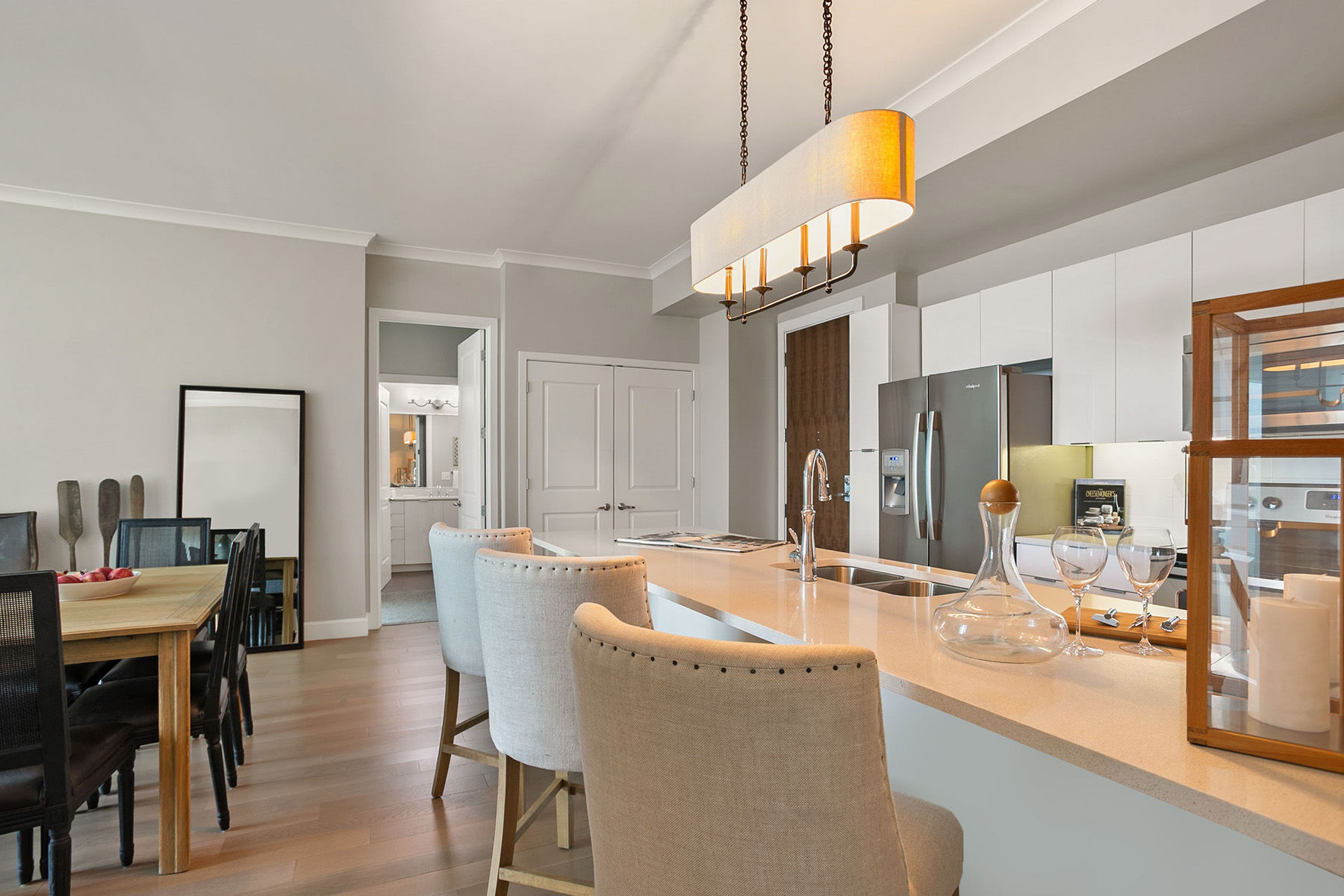 A modern kitchen with a dining table and chairs.