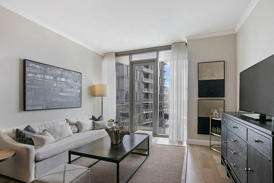 a living room with a couch and a table and a television