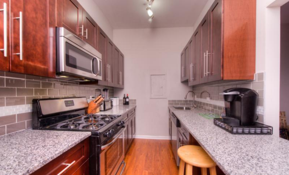 a kitchen with a stove and a counter top