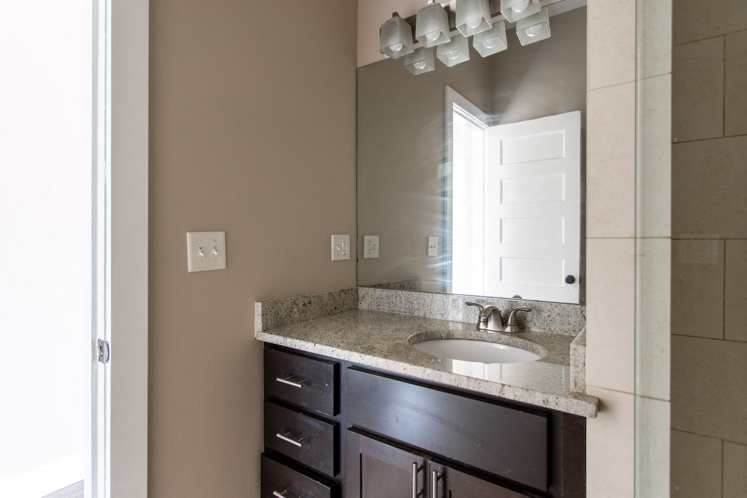 a bathroom with a sink and a mirror