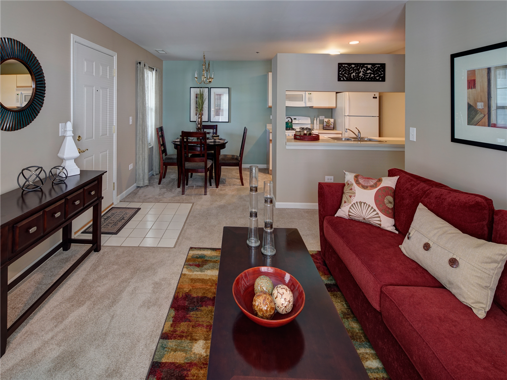 a living room and dining room with a couch and a table