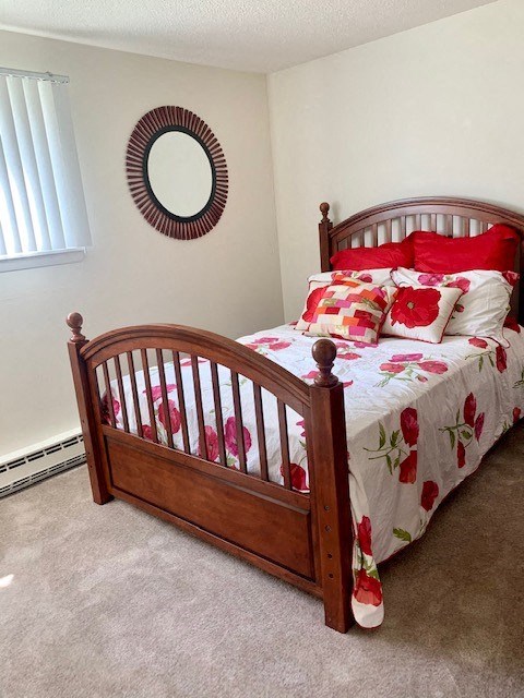 a bedroom with a bed with pillows on it