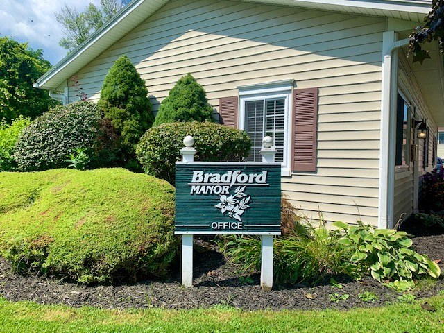 a sign in front of a house