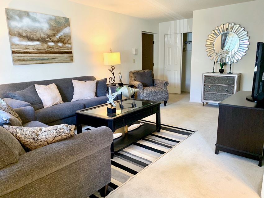 a living room with couches and a coffee table