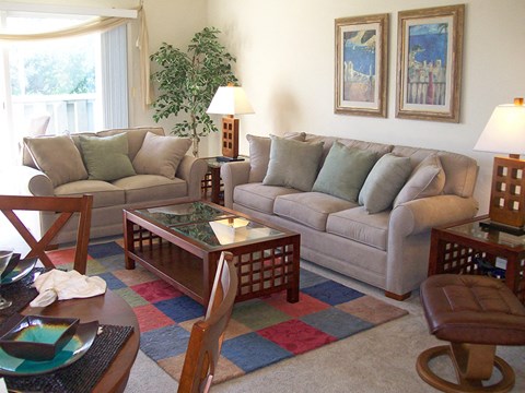 a living room with couches and a table