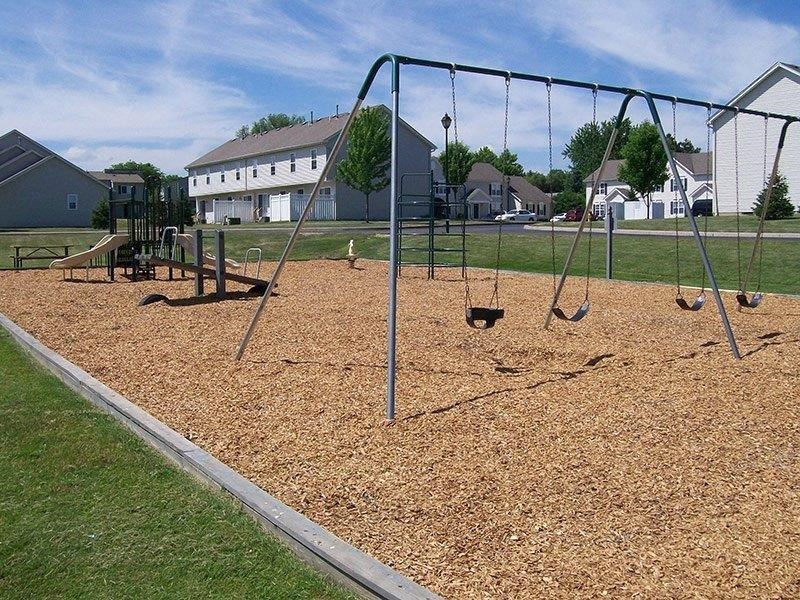 Playground with Swing Set at Stone Hedge Village Townhouses, Farmington, NY