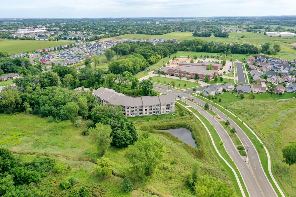a view of a city from the air with a highway and a building