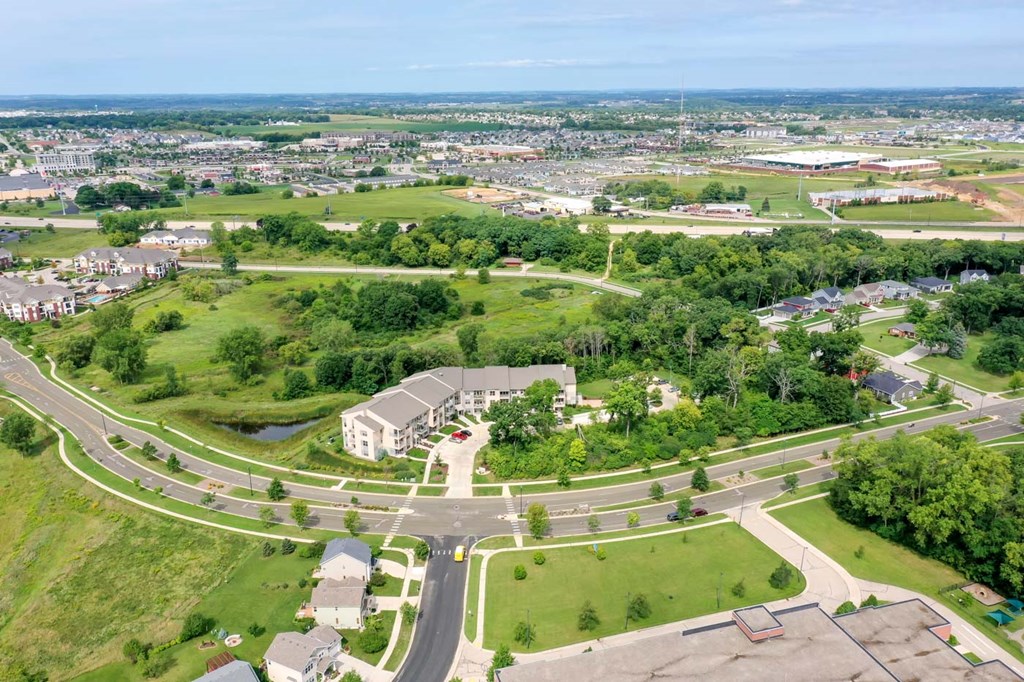 an aerial view of a city with roads and buildings