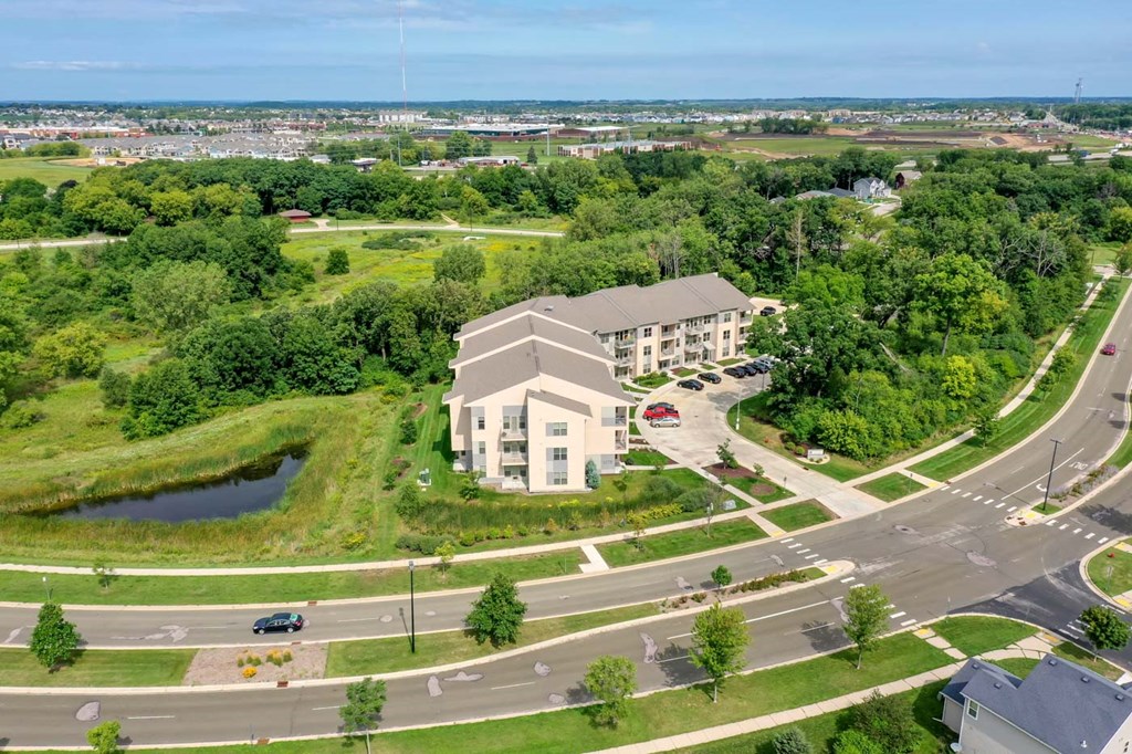 an aerial view of an office building and a parking lot
