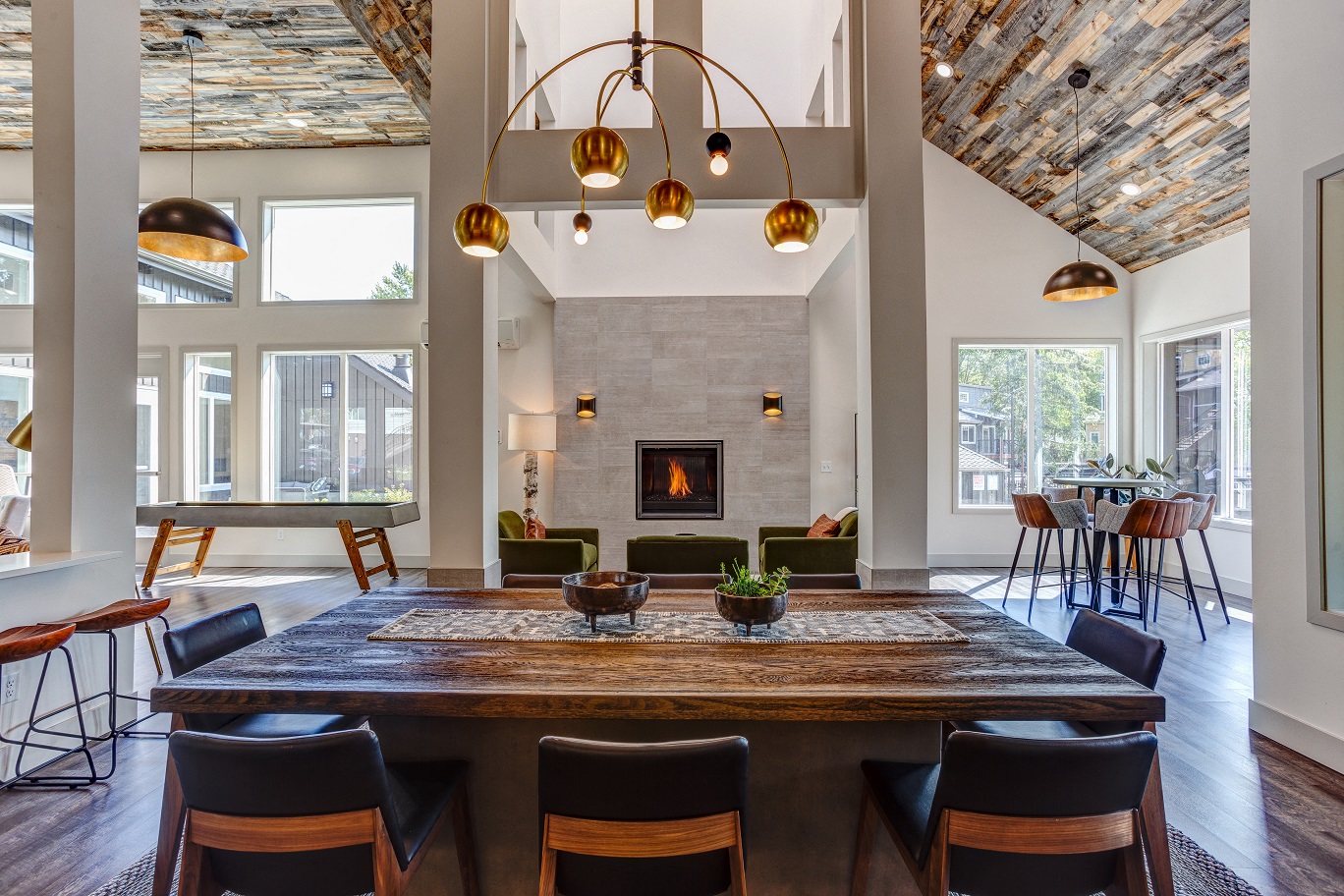 a large dining room with a table and chairs and a fireplace