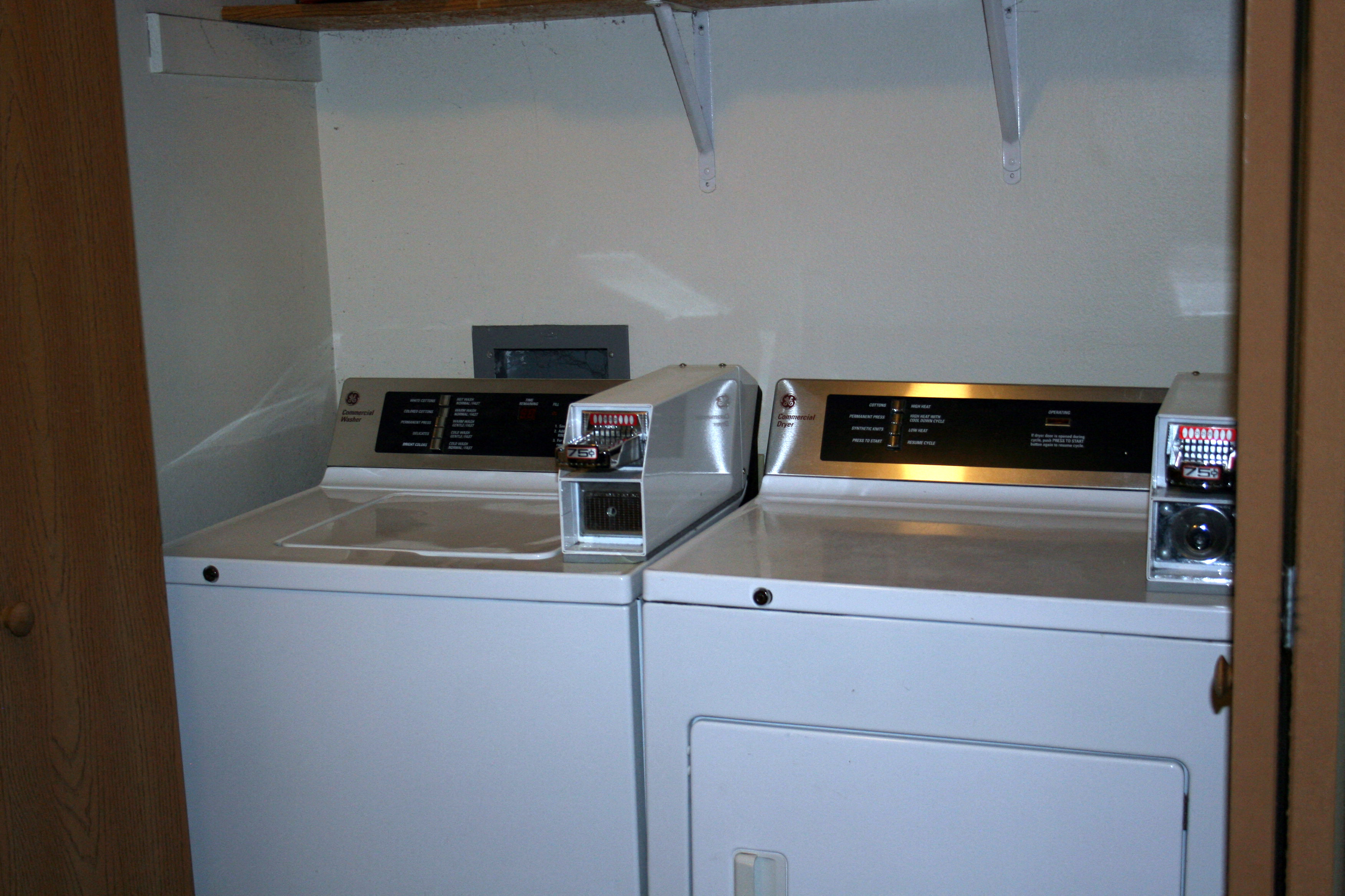A white dishwasher with a silver top is in a kitchen.