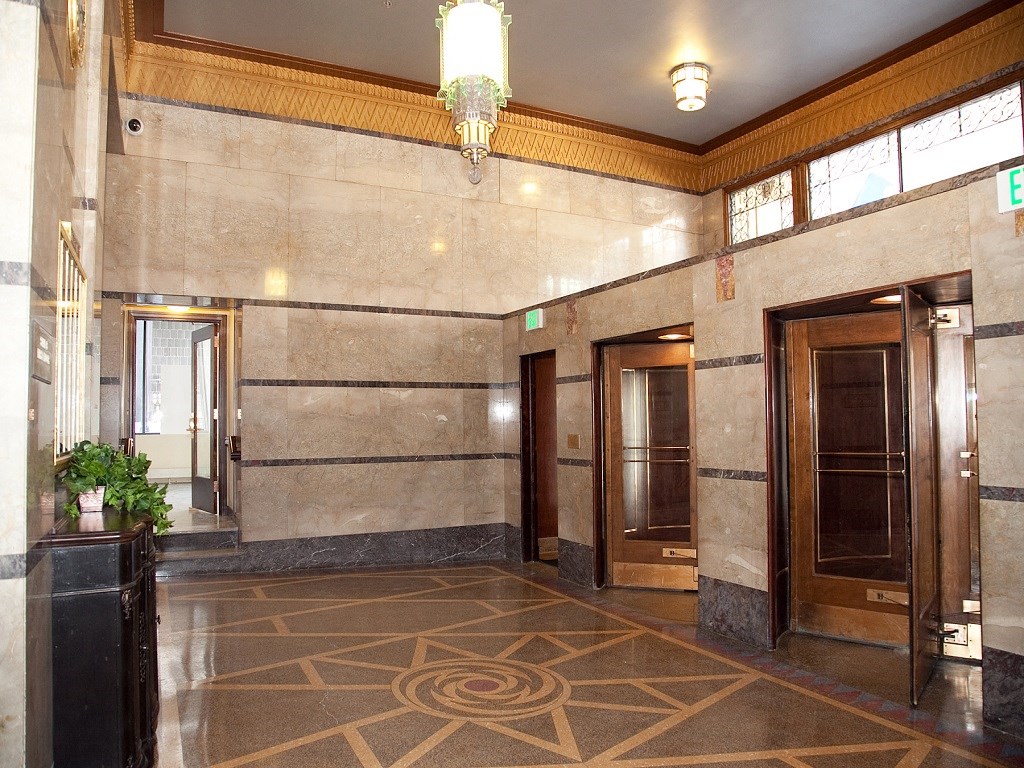 a view of the lobby of a building with doors