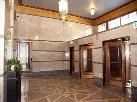 a view of the lobby of a building with doors