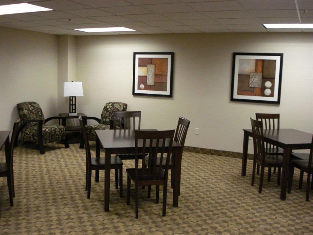 a dining room with a table and chairs
