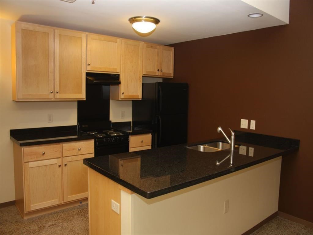 a kitchen with a counter top and a sink