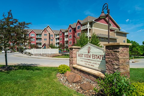 an apartment building with a sign that reads east view estates