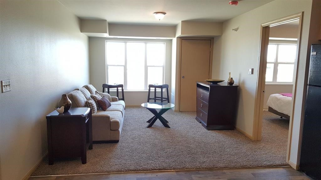 a living room with a couch and a table