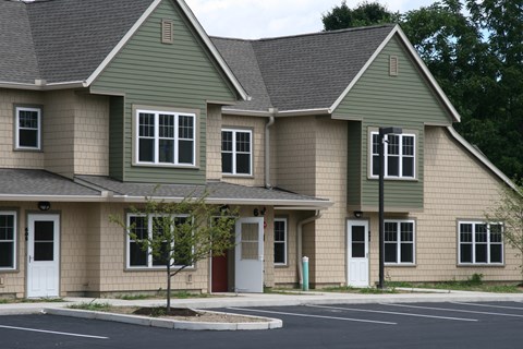 a large house with a street in front of it