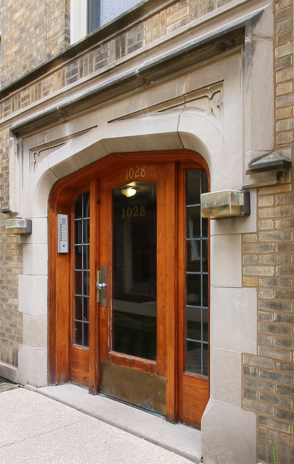 the entrance to a building with a wooden door