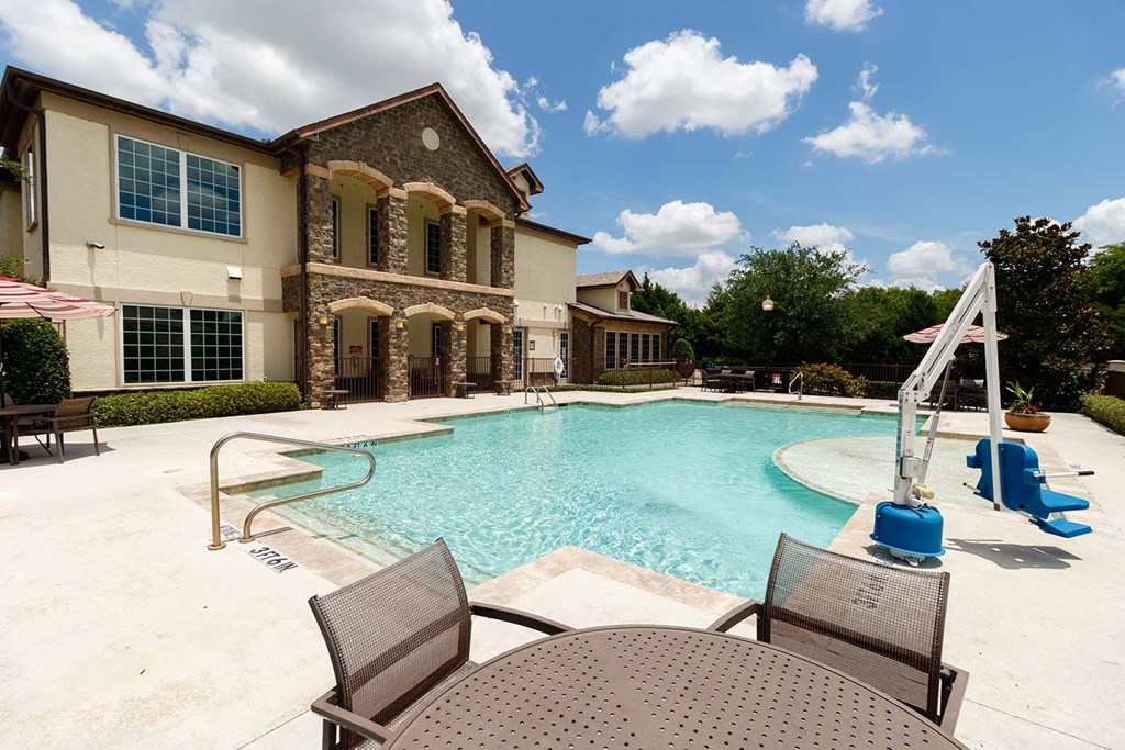 our apartments offer a large swimming pool with patio furniture