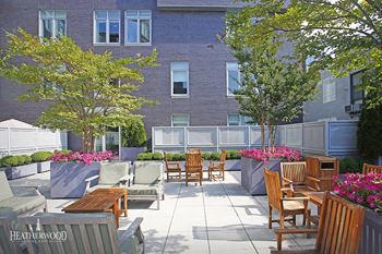 outdoor lounge area with bbq grills at 568 Union, New York, 11211