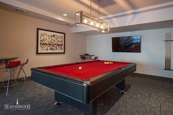 pool table with red cover at 568 Union, Brooklyn, NY