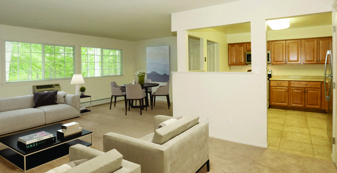 living room with chairs and couches and dining room in the background at Town & Country Luxury Apartments, Hampton Bays, 11946