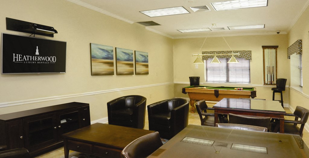 community center with card tables, chairs and tvs at Town & Country Luxury Apartments, New York